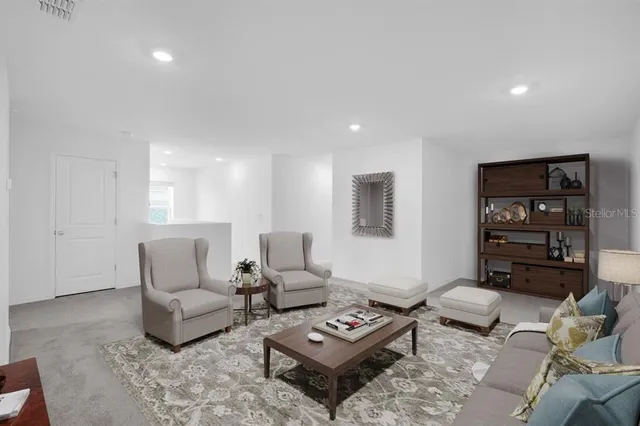 a bedroom with a bed and a lamp