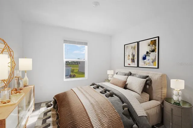 a bedroom with a bed and wall painting