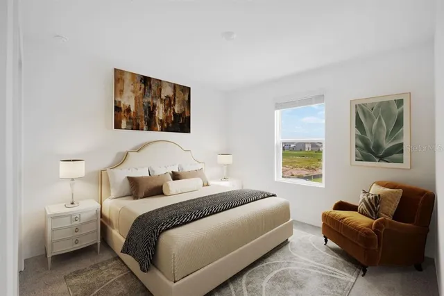 a bedroom with a bed and furniture