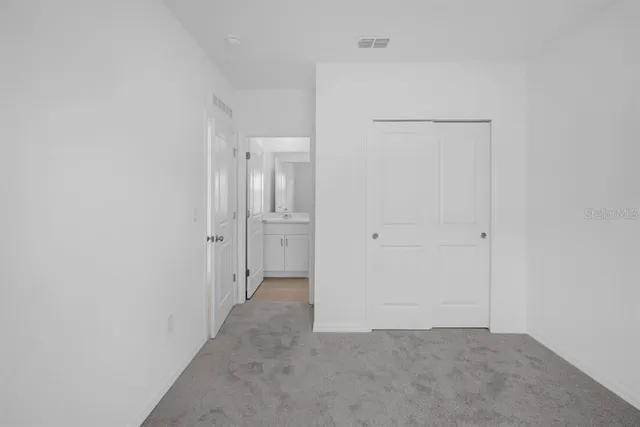 a bathroom with a double vanity sink and mirror