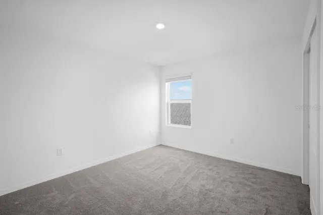 a bathroom with a toilet and a bathtub