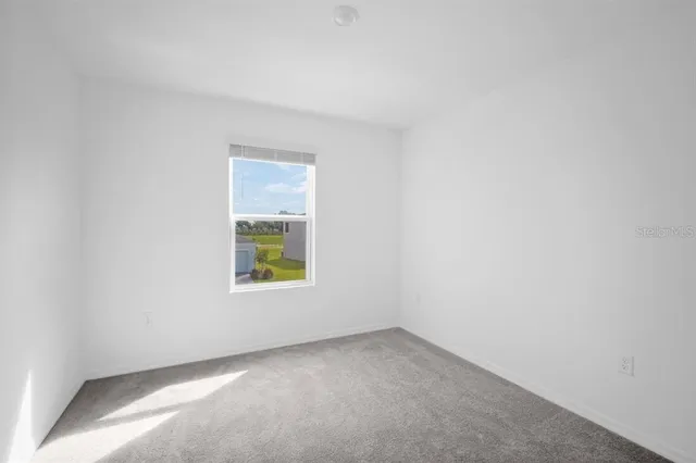 a view of swimming pool with outdoor seating and lake view