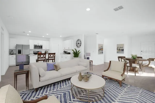 a living room with furniture and a couch