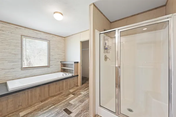 a bathroom with a shower and a window
