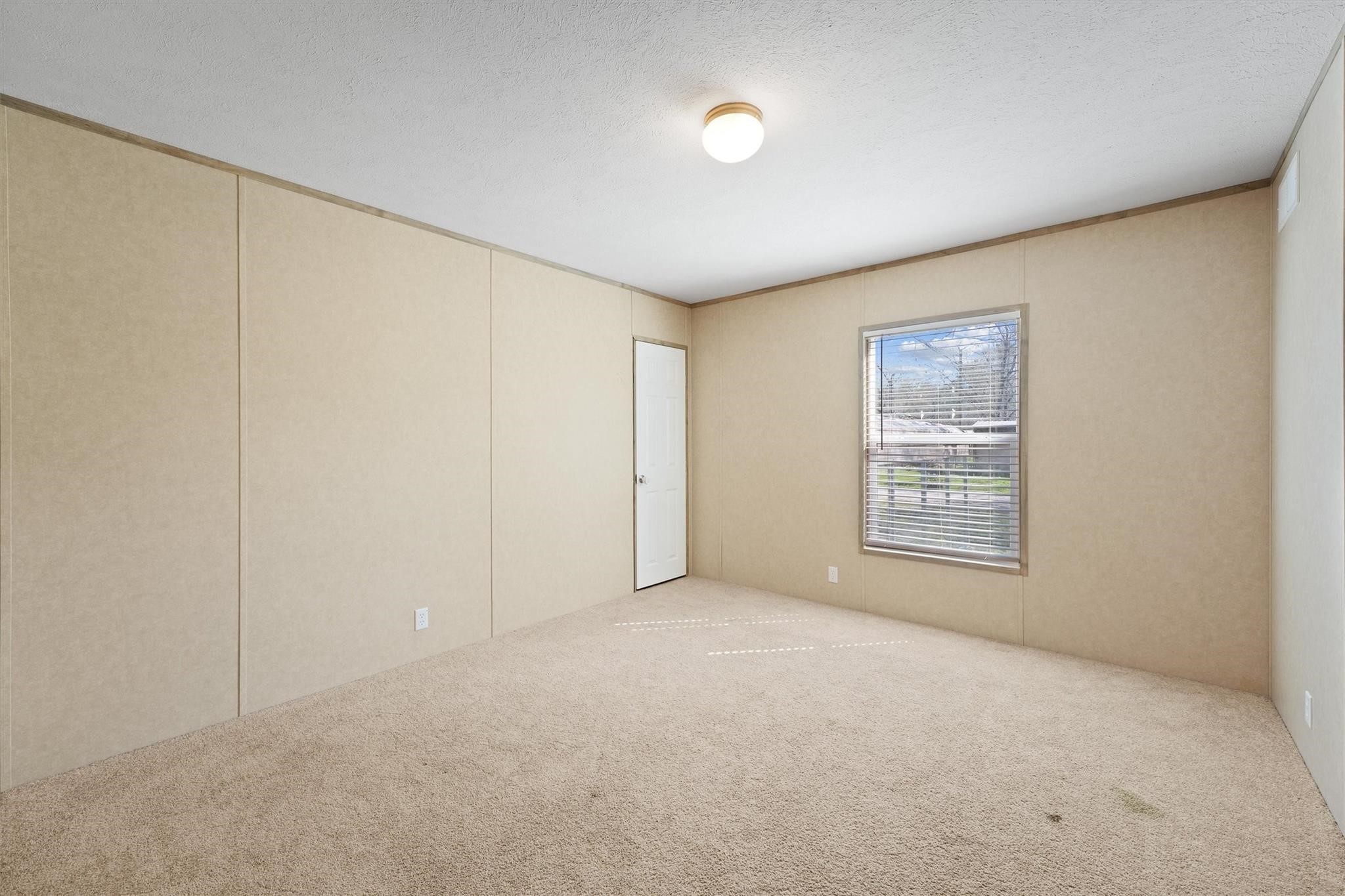 11744 Padok Road Houston, TX 77044 - Photo 13 of 21 an empty room with windows
