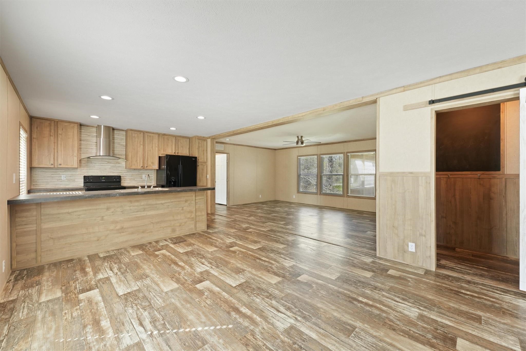 11744 Padok Road Houston, TX 77044 - Photo 4 of 21 a view of large kitchen with a sink and refrigerator