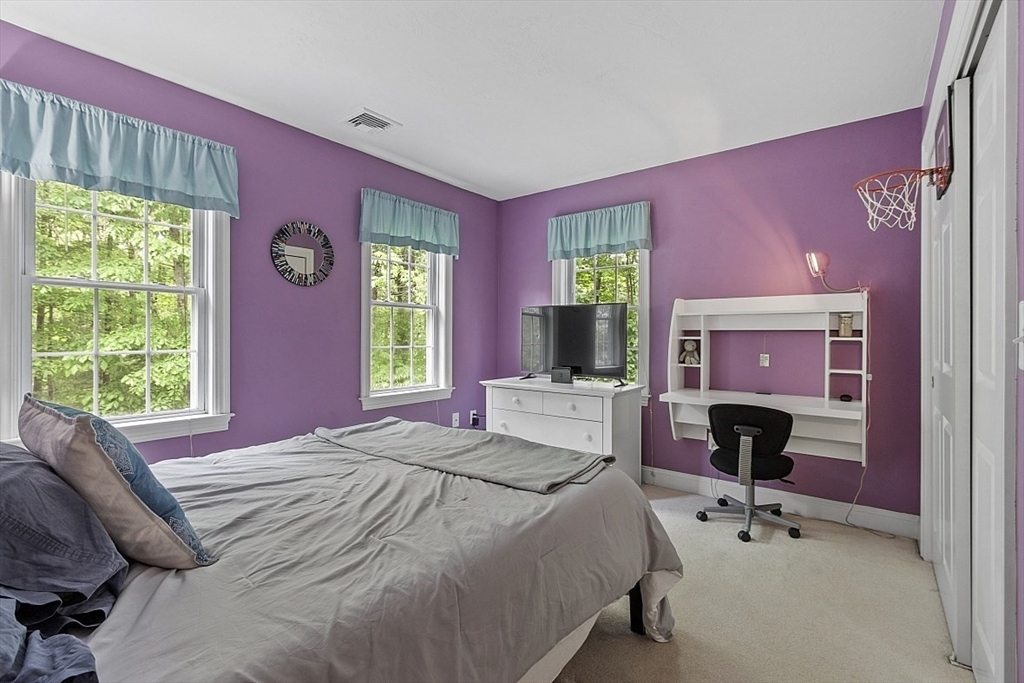 34 Ball Hill Road Princeton, MA 01541 - Photo 23 of 37 a bedroom with a bed and a flat screen tv