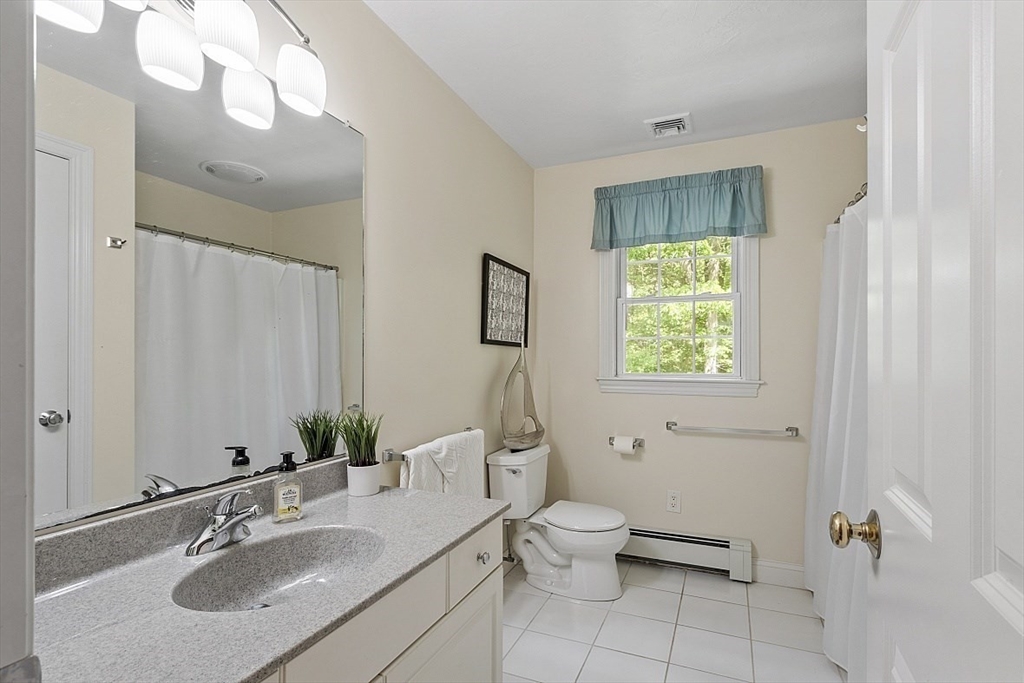 34 Ball Hill Road Princeton, MA 01541 - Photo 24 of 37 a bathroom with a toilet sink and mirror