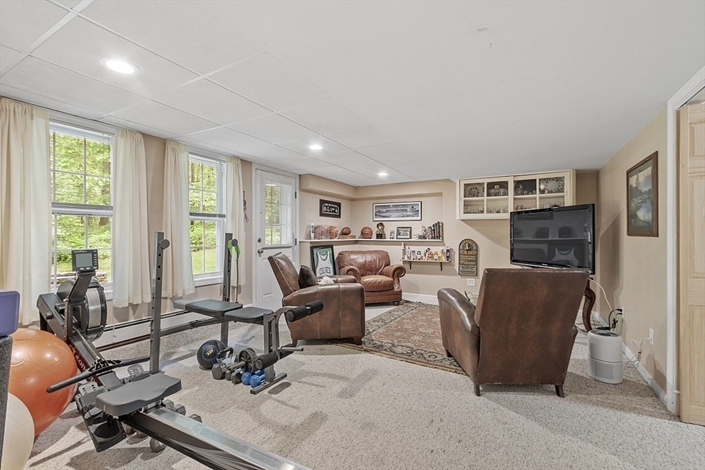 34 Ball Hill Road Princeton, MA 01541 - Photo 25 of 37 a living room with furniture large windows and wooden floor