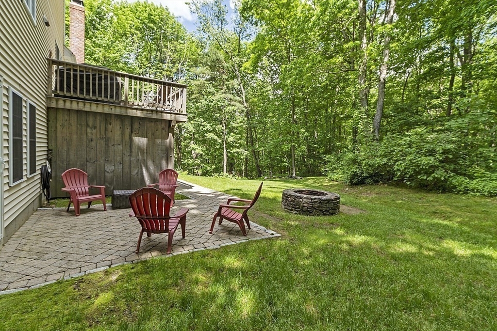 34 Ball Hill Road Princeton, MA 01541 - Photo 35 of 37 a view of a patio with a table and chairs