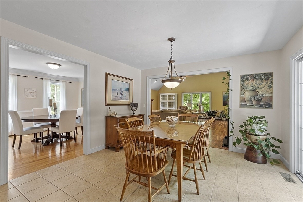 34 Ball Hill Road Princeton, MA 01541 - Photo 7 of 37 a view of a dining room and livingroom with furniture wooden floor a chandelier and a painting