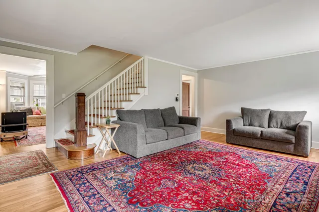 a living room with furniture and a rug