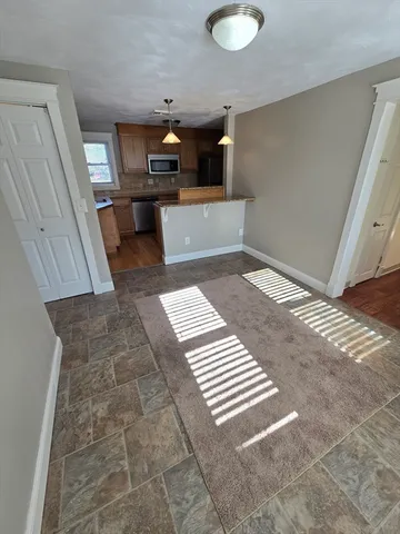 wooden floor with a rug