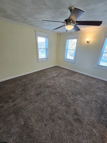 a view of empty room with windows