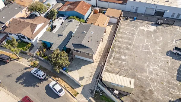an aerial view of a residential apartment building with a yard