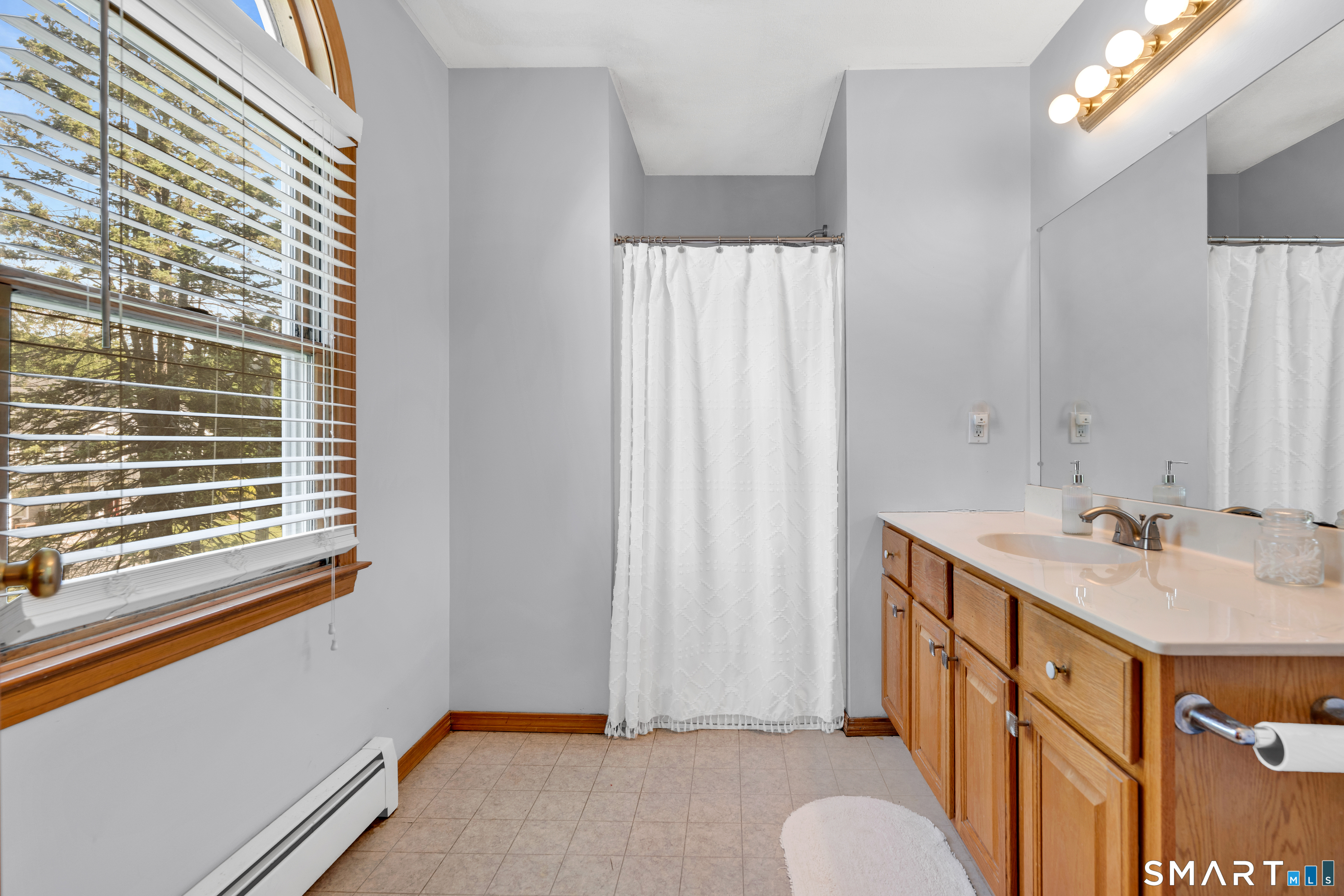 89 Windsorville Road South Windsor, CT 06074 - Photo 13 of 23 a bathroom with a sink and a mirror