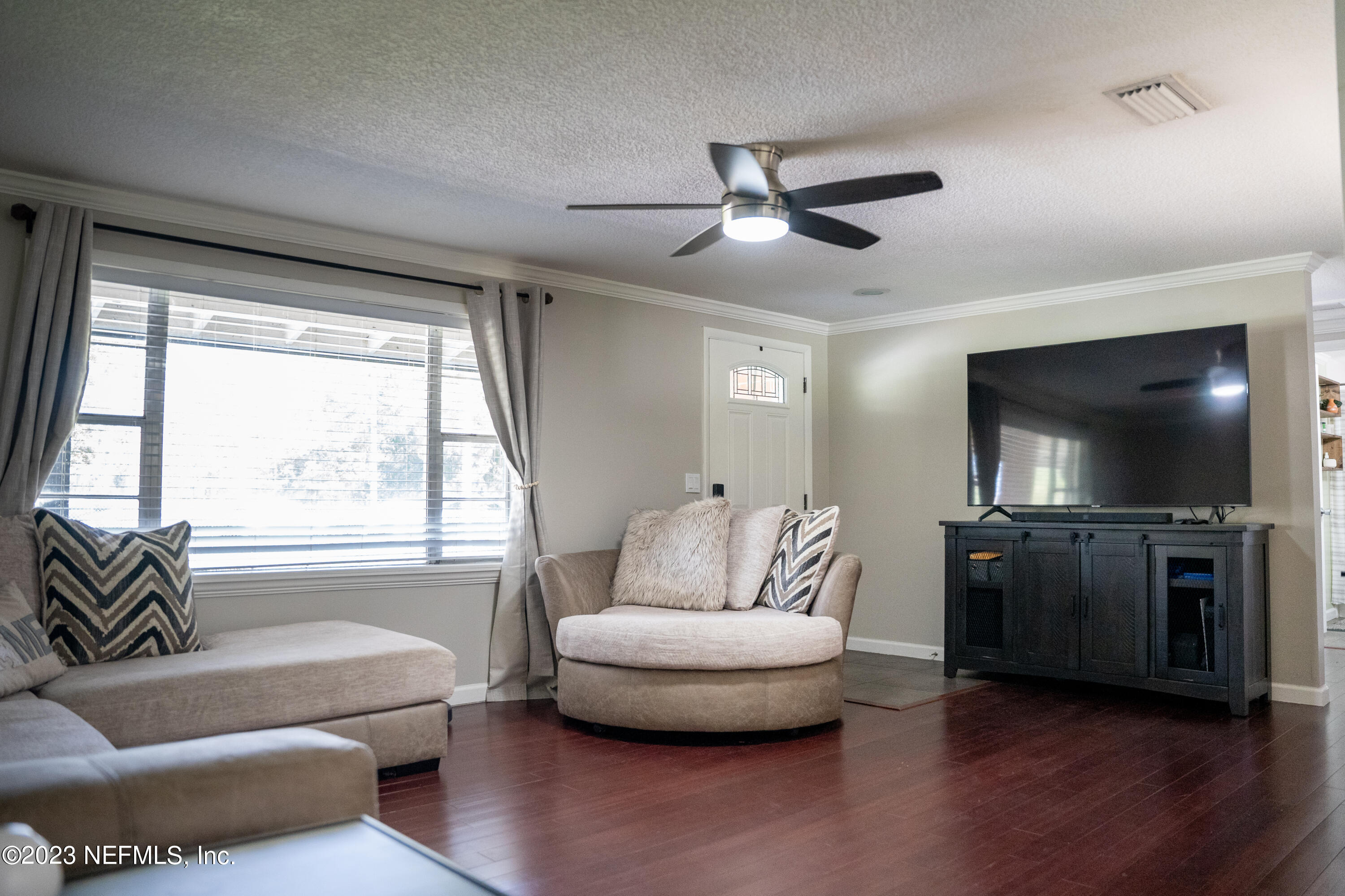 9008 Old Kings Road Jacksonville, FL 32219 - Photo 14 of 22 a living room with furniture and a flat screen tv