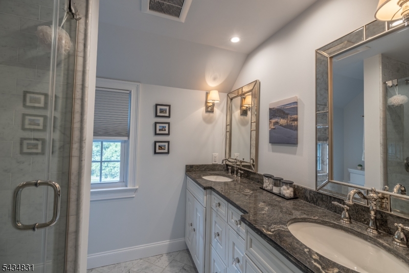 200 Wychwood Road Westfield, NJ 07090 - Photo 16 of 31 a bathroom with a granite countertop double vanity sink and mirror
