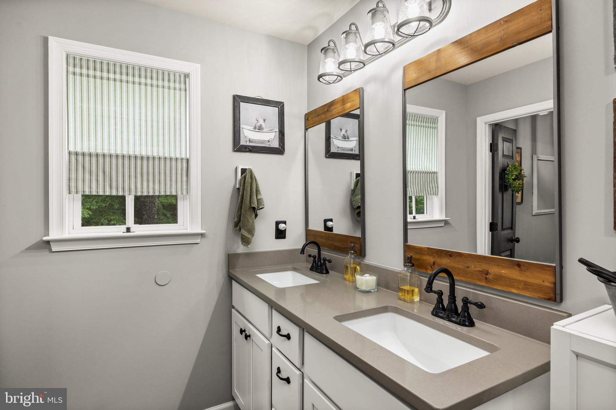 30367 Old Locust Grove Locust Grove, VA 22508 - Photo 20 of 36 a bathroom with a sink double vanity and a mirror