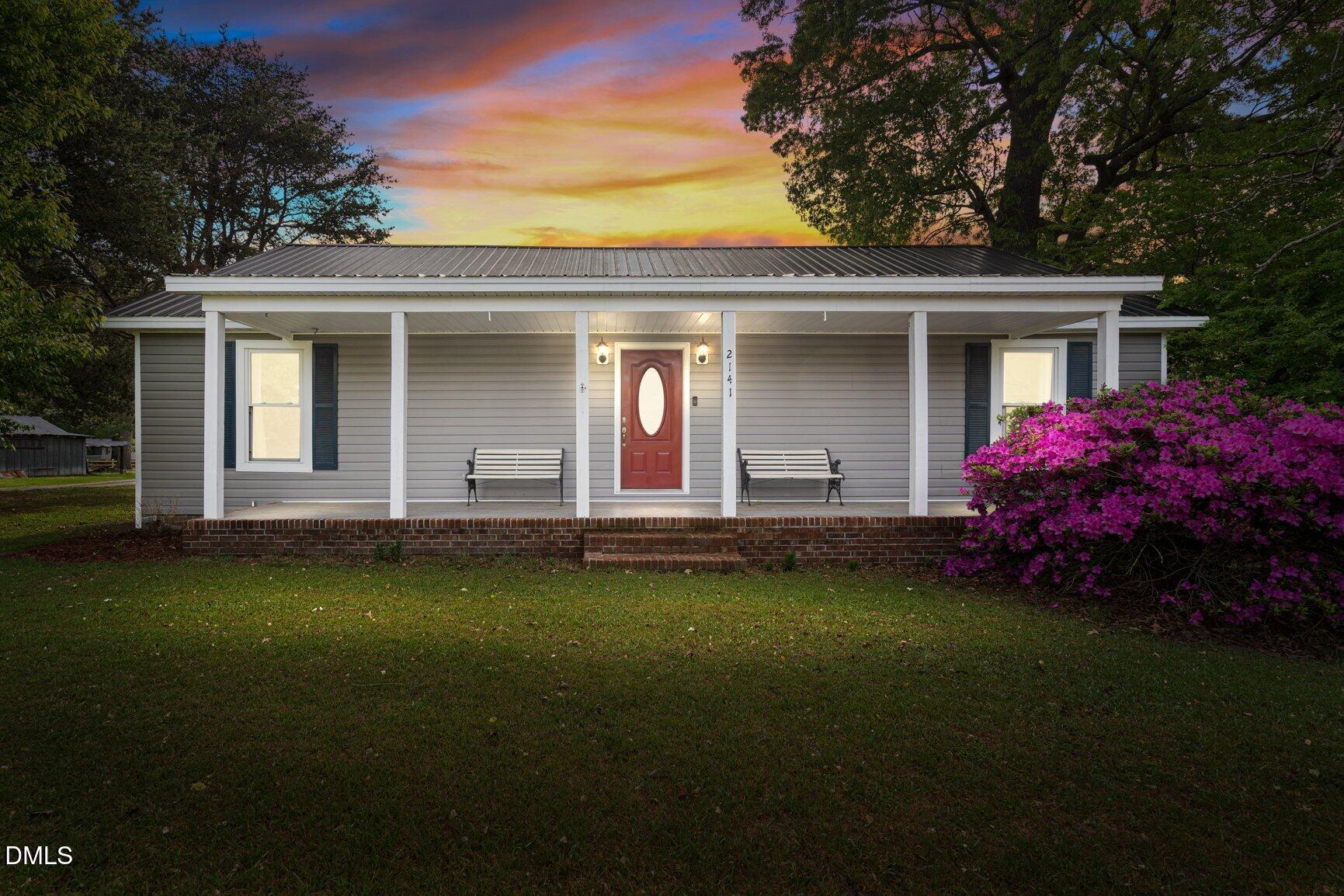 2141 McNair Road Tarboro, NC 27886 - Photo 1 of 55 a front view of a house with garden