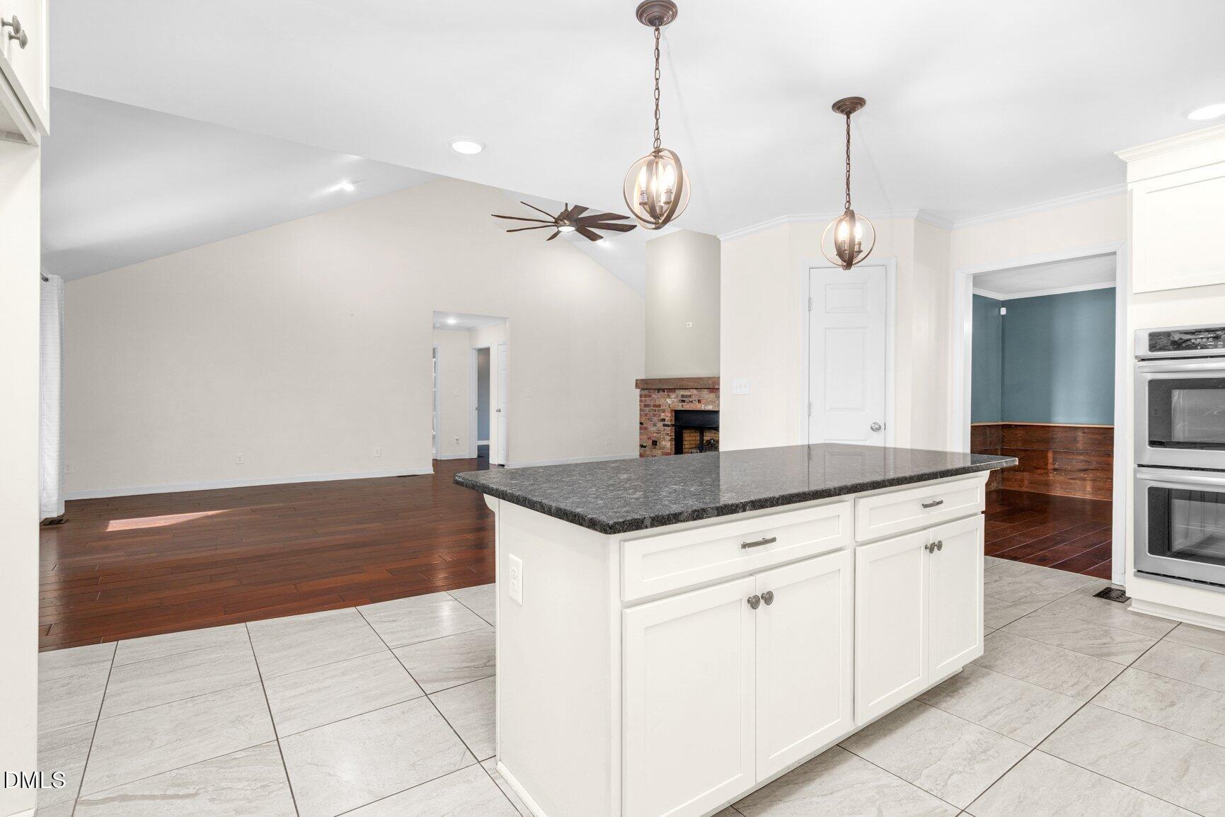 2141 McNair Road Tarboro, NC 27886 - Photo 11 of 55 a kitchen with granite countertop a sink and a stove