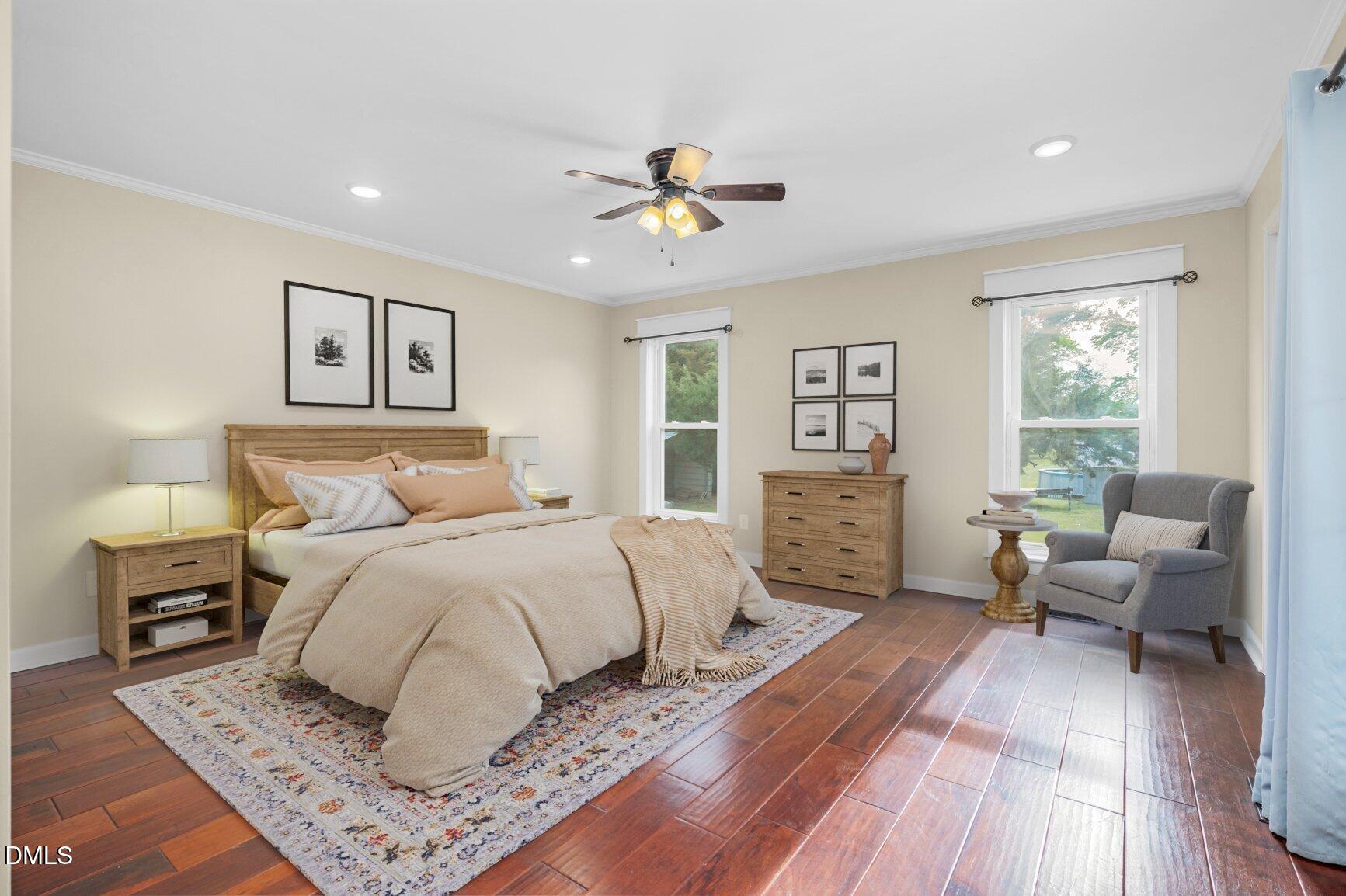 2141 McNair Road Tarboro, NC 27886 - Photo 15 of 55 a bedroom with a large bed and a couch