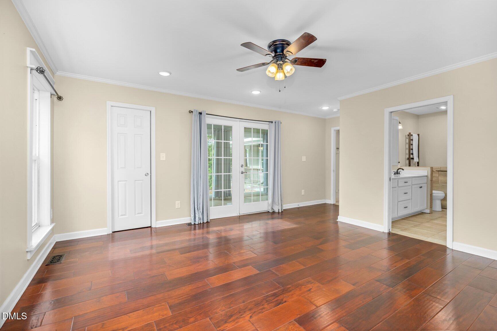 2141 McNair Road Tarboro, NC 27886 - Photo 16 of 55 a view of an empty room with wooden floor and a window