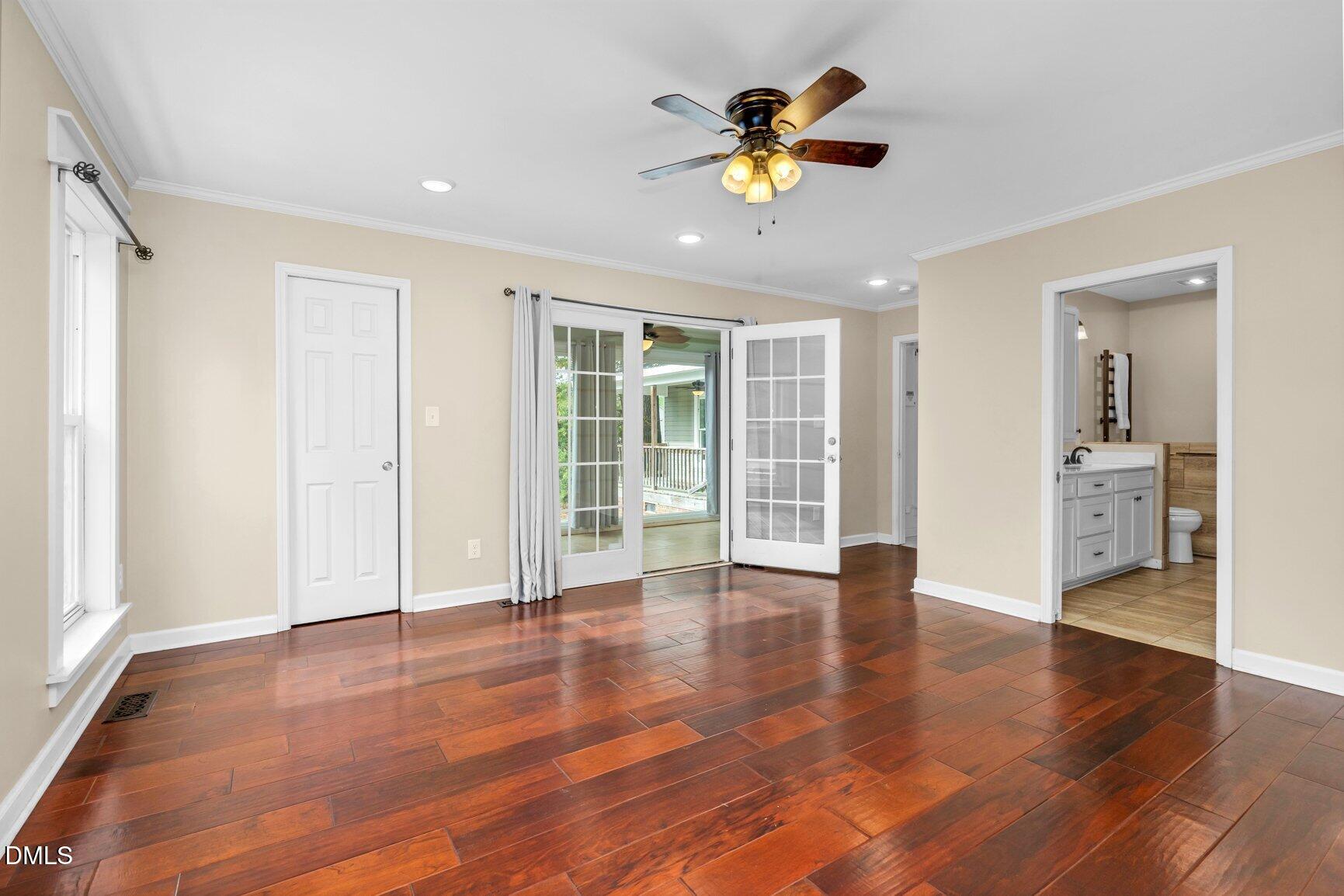 2141 McNair Road Tarboro, NC 27886 - Photo 17 of 55 a view of an empty room with a window and wooden floor
