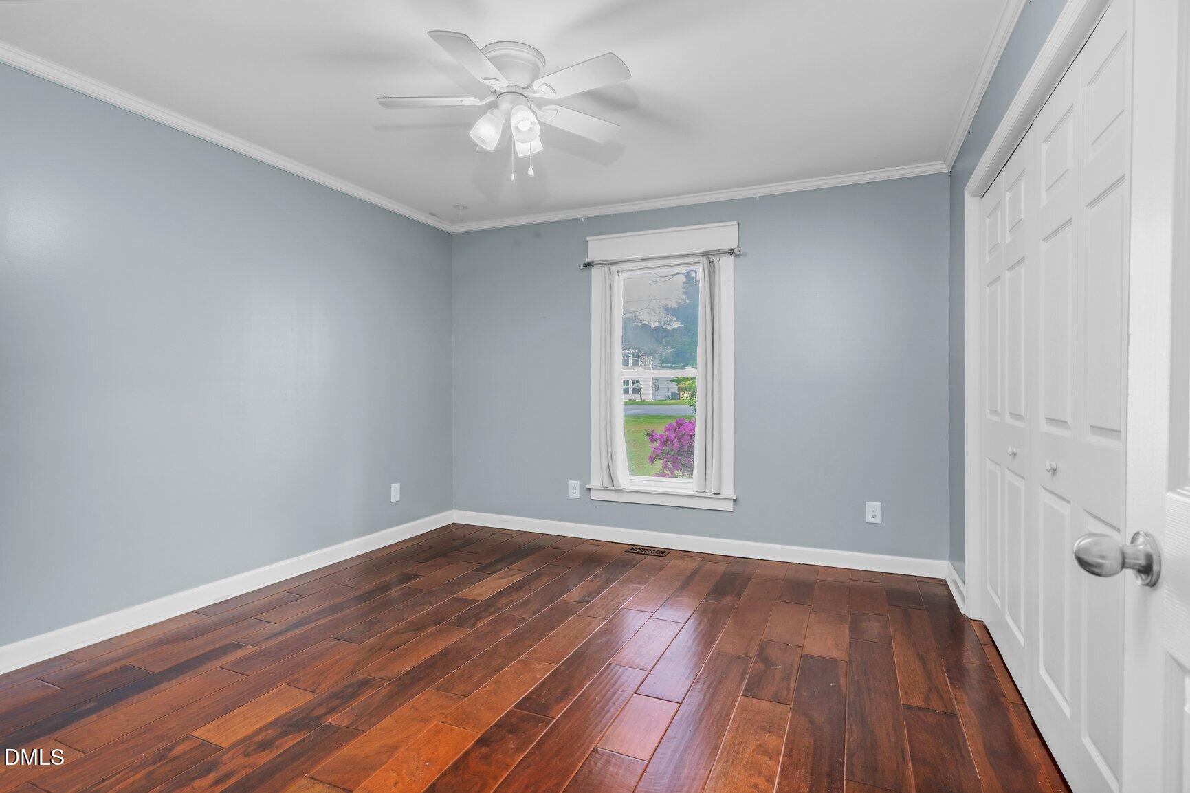 2141 McNair Road Tarboro, NC 27886 - Photo 23 of 55 wooden floor in an empty room with a window