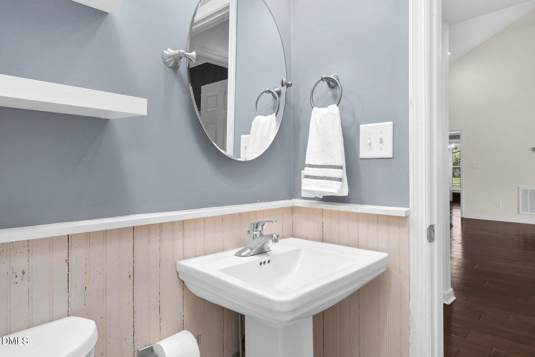 2141 McNair Road Tarboro, NC 27886 - Photo 24 of 55 a bathroom with a toilet sink and mirror