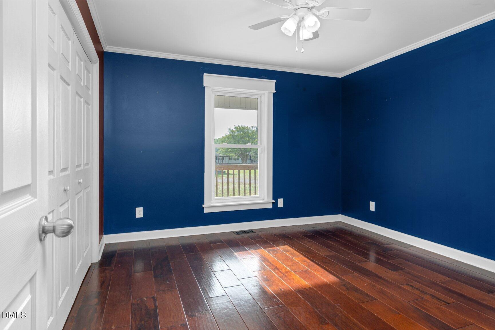 2141 McNair Road Tarboro, NC 27886 - Photo 27 of 55 a view of empty room with window and wooden floor