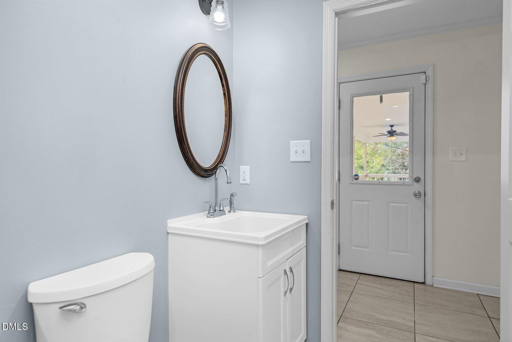 2141 McNair Road Tarboro, NC 27886 - Photo 28 of 55 a bathroom with a toilet and a sink