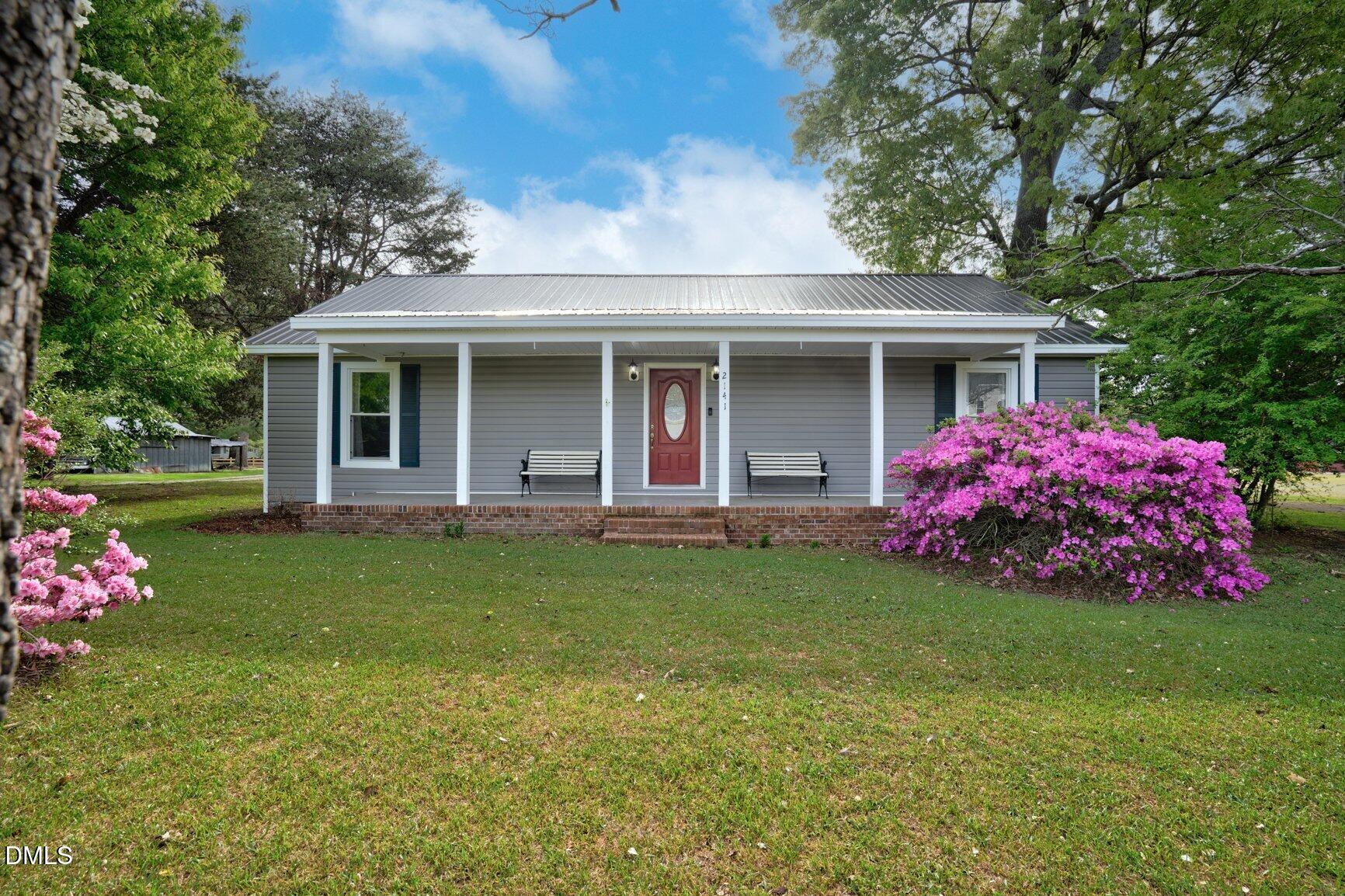2141 McNair Road Tarboro, NC 27886 - Photo 2 of 55 a front view of house with yard and green space