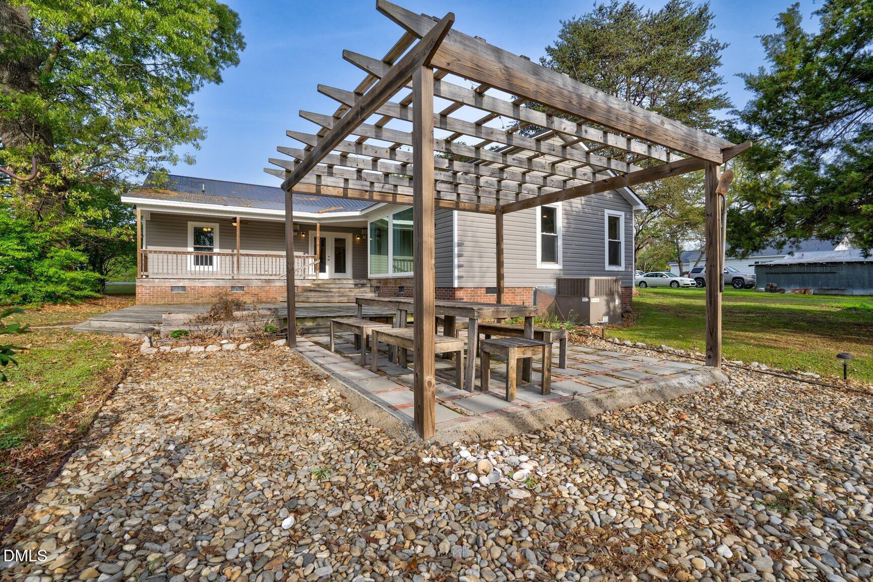 2141 McNair Road Tarboro, NC 27886 - Photo 34 of 55 a view of a house with a yard patio and sitting area