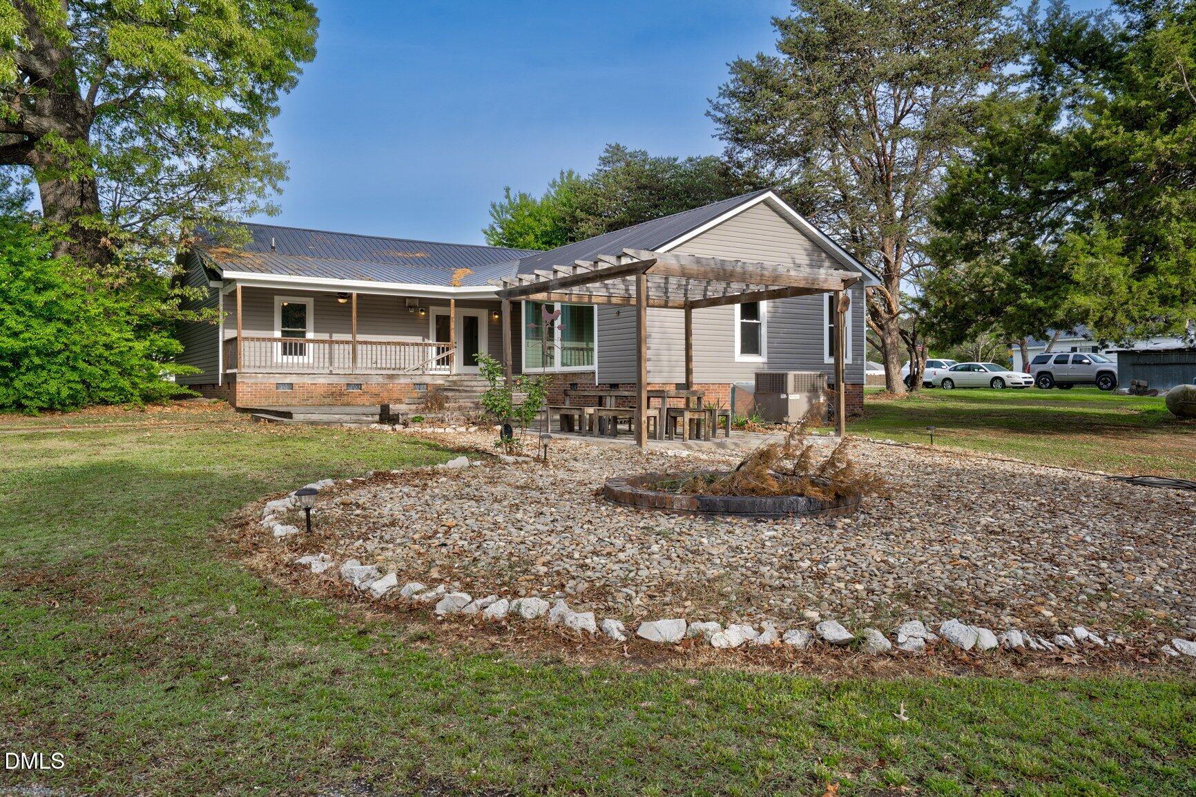 2141 McNair Road Tarboro, NC 27886 - Photo 35 of 55 a front view of a house with garden