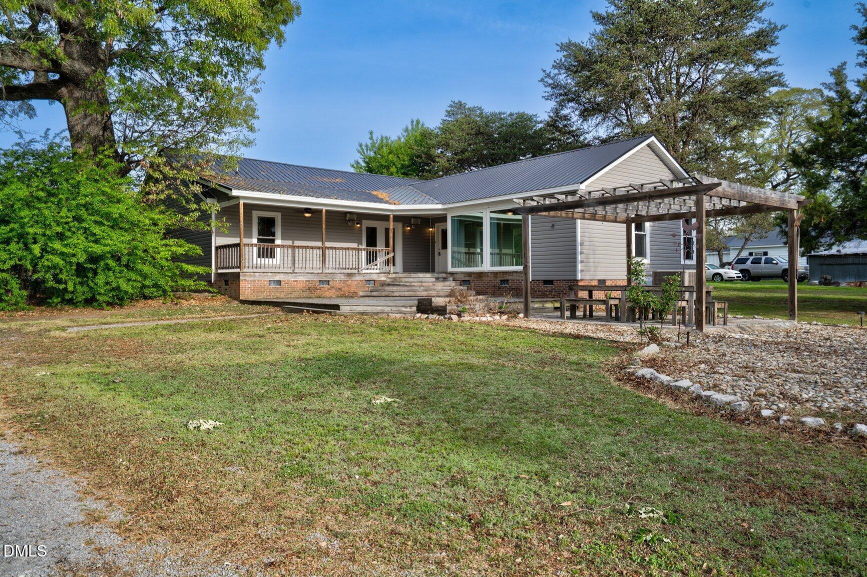 2141 McNair Road Tarboro, NC 27886 - Photo 36 of 55 a front view of a house with garden