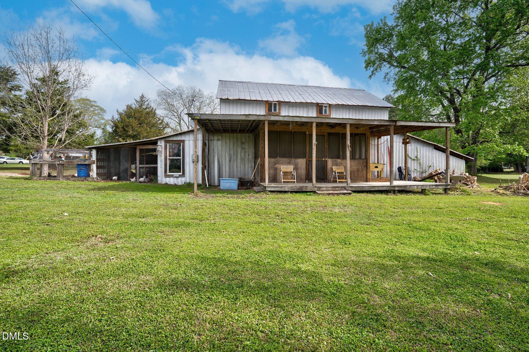 2141 McNair Road Tarboro, NC 27886 - Photo 37 of 55 a front view of a house with garden
