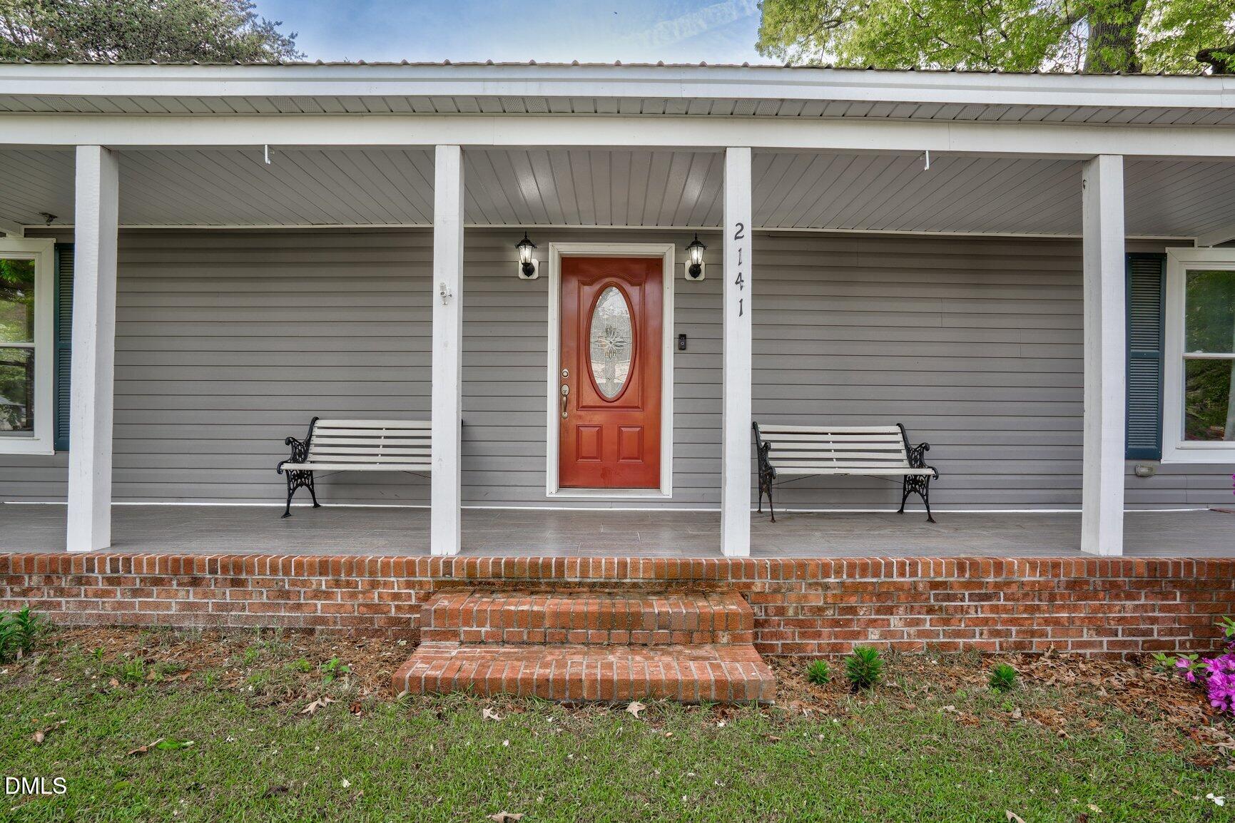 2141 McNair Road Tarboro, NC 27886 - Photo 3 of 55 a front view of a house with garden