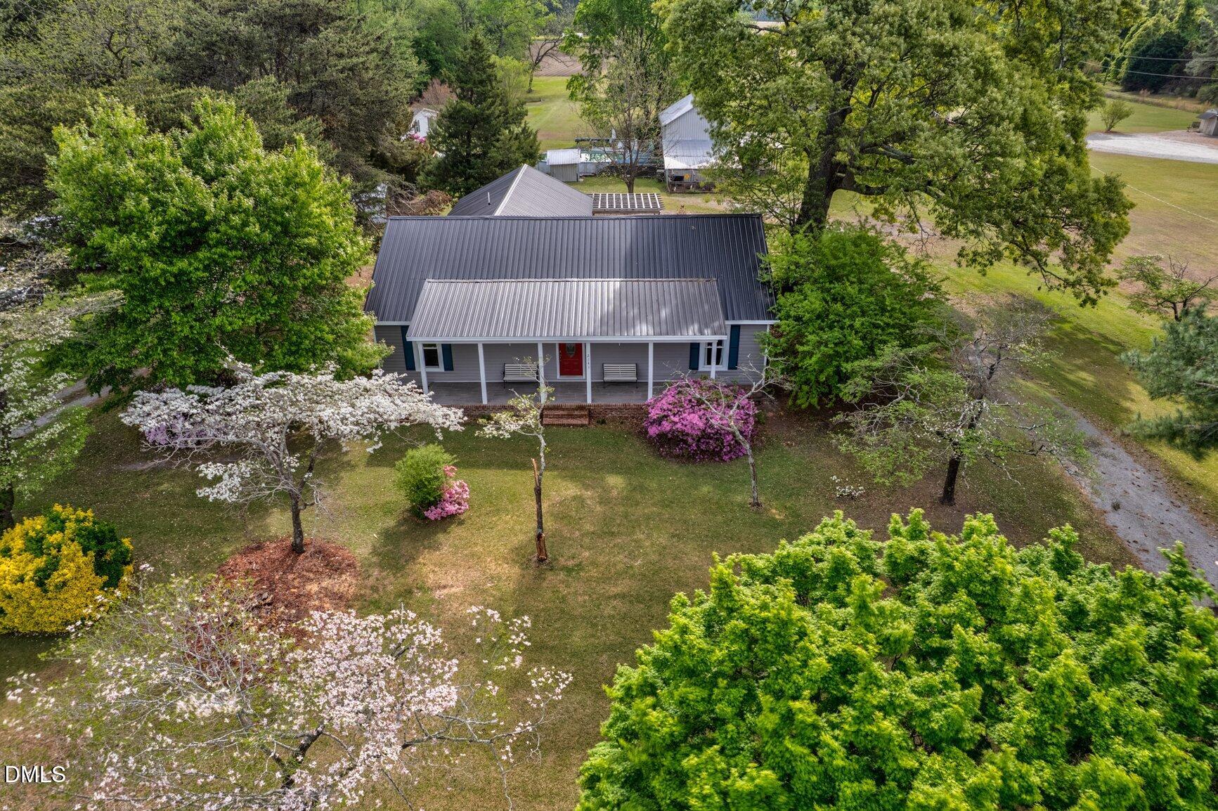 2141 McNair Road Tarboro, NC 27886 - Photo 48 of 55 a view of a house with a big yard and a large tree