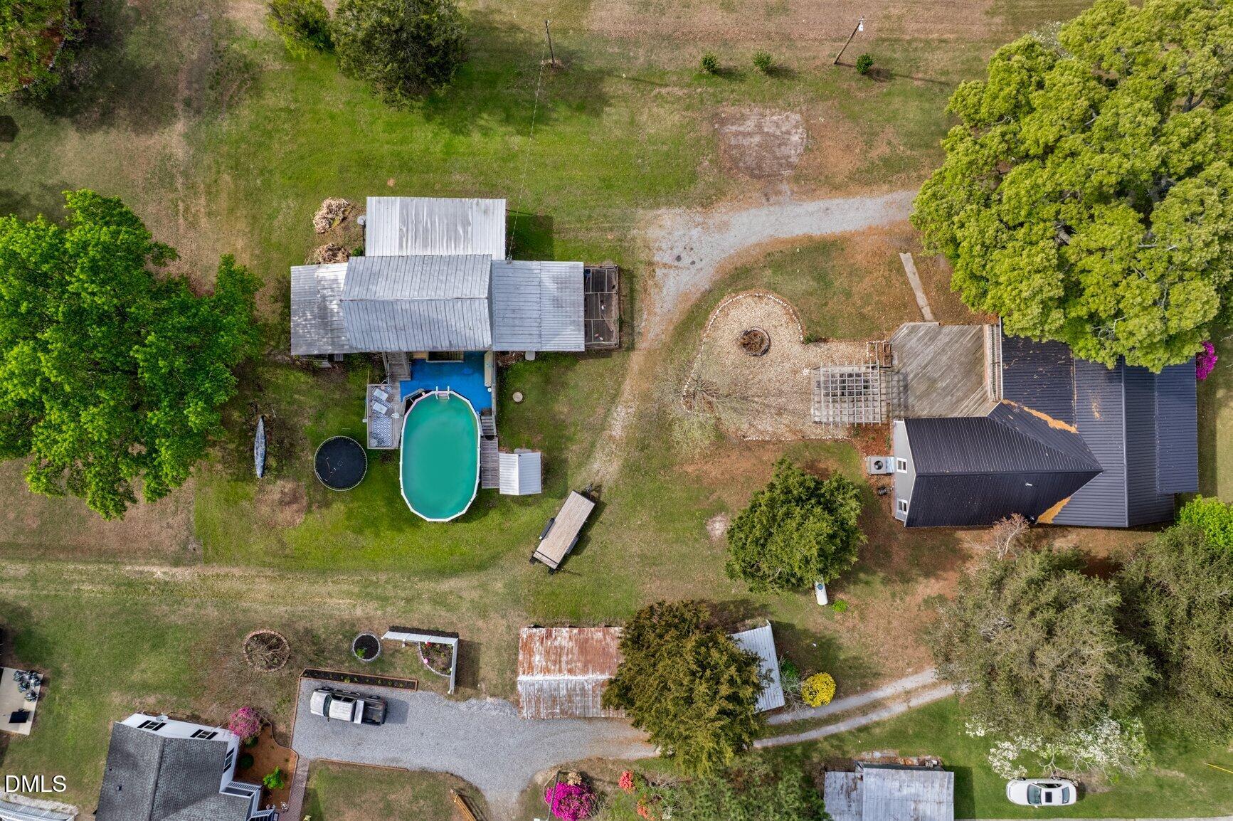 2141 McNair Road Tarboro, NC 27886 - Photo 51 of 55 an aerial view of a house with a swimming pool and outdoor seating