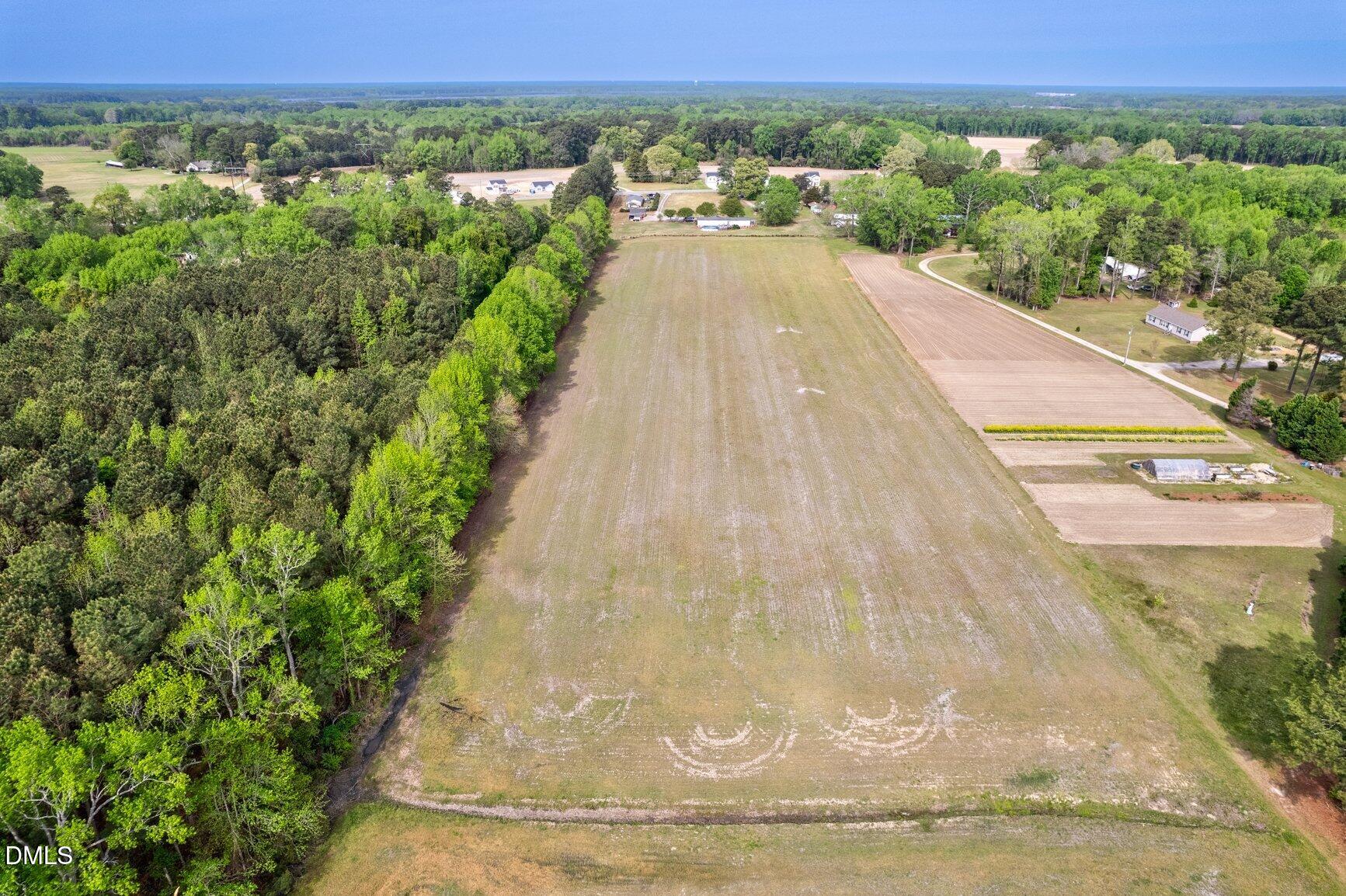 2141 McNair Road Tarboro, NC 27886 - Photo 53 of 55 a view of a swimming pool with a yard and mountain view