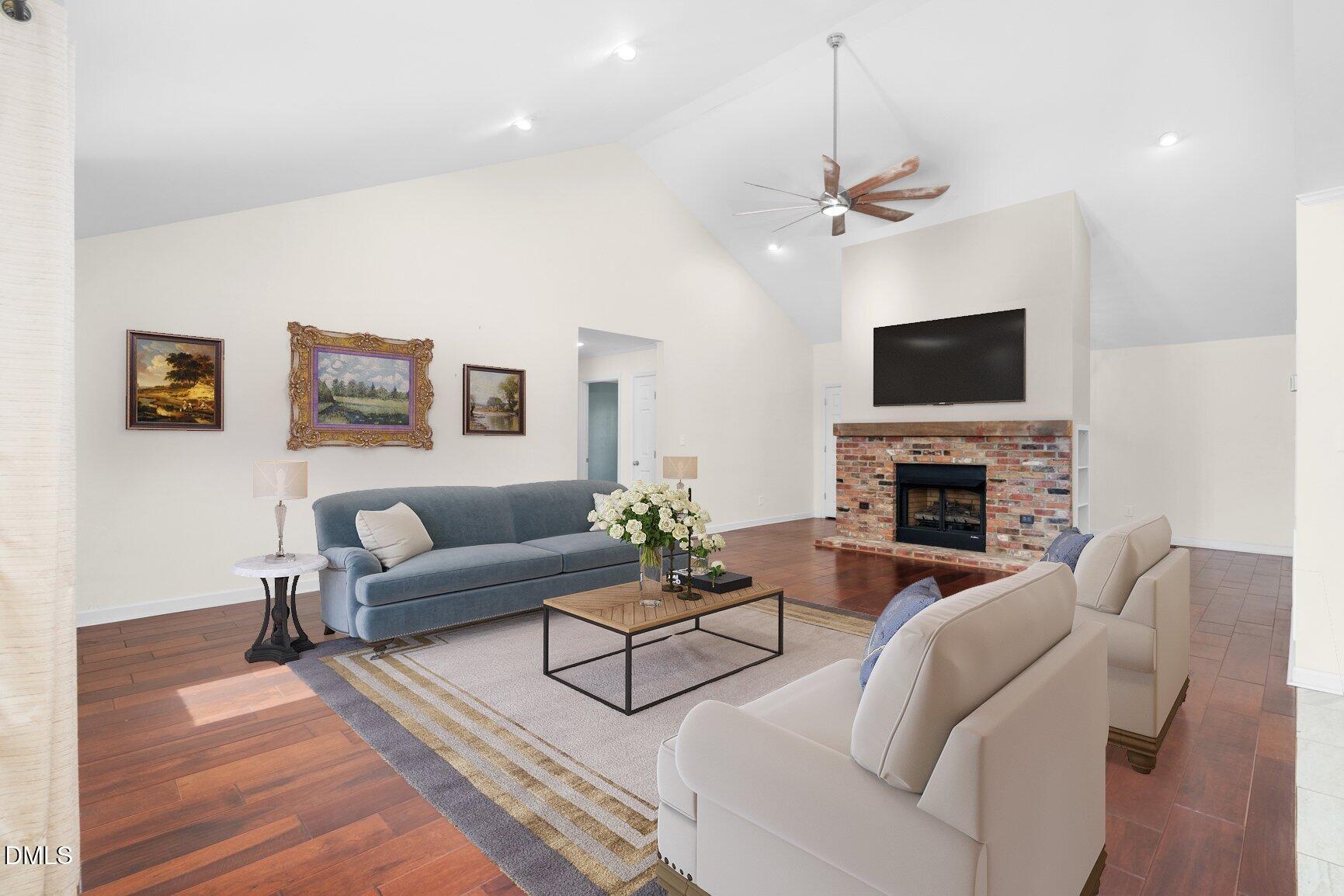 2141 McNair Road Tarboro, NC 27886 - Photo 5 of 55 a living room with furniture a fireplace and a flat screen tv