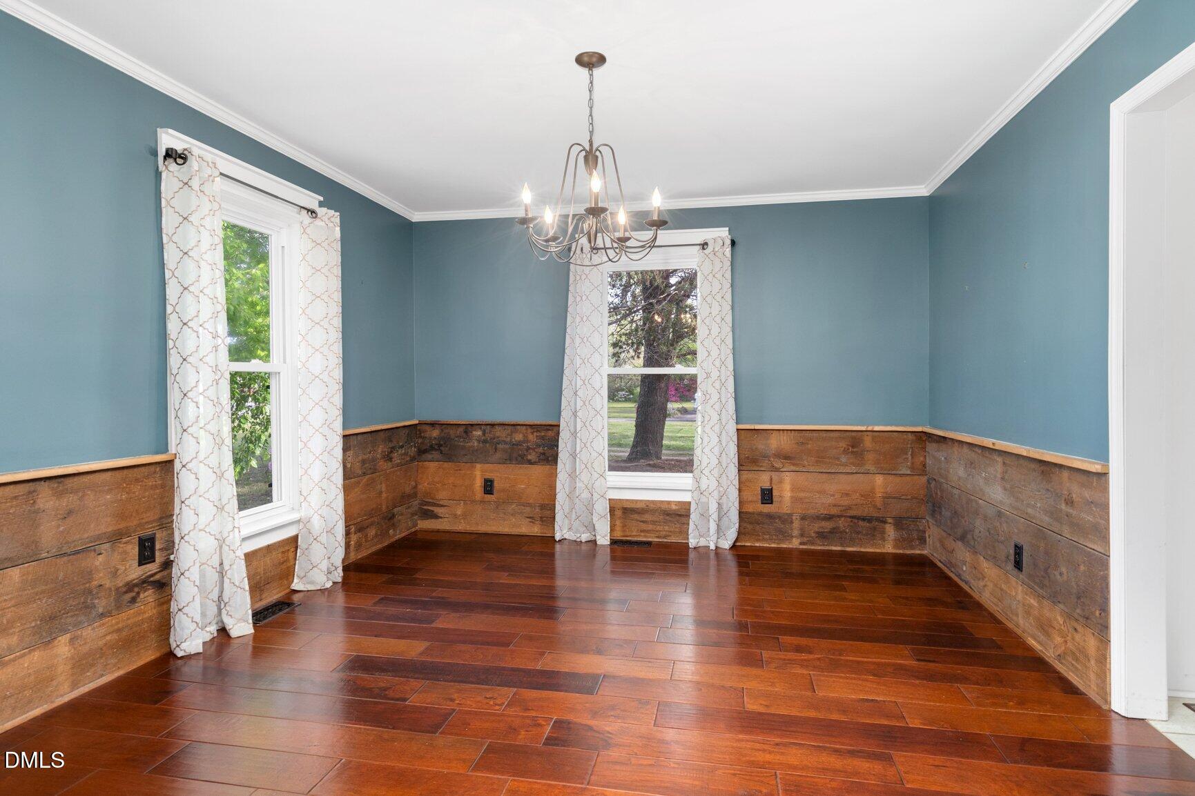 2141 McNair Road Tarboro, NC 27886 - Photo 8 of 55 a view of an empty room with window and wooden floor