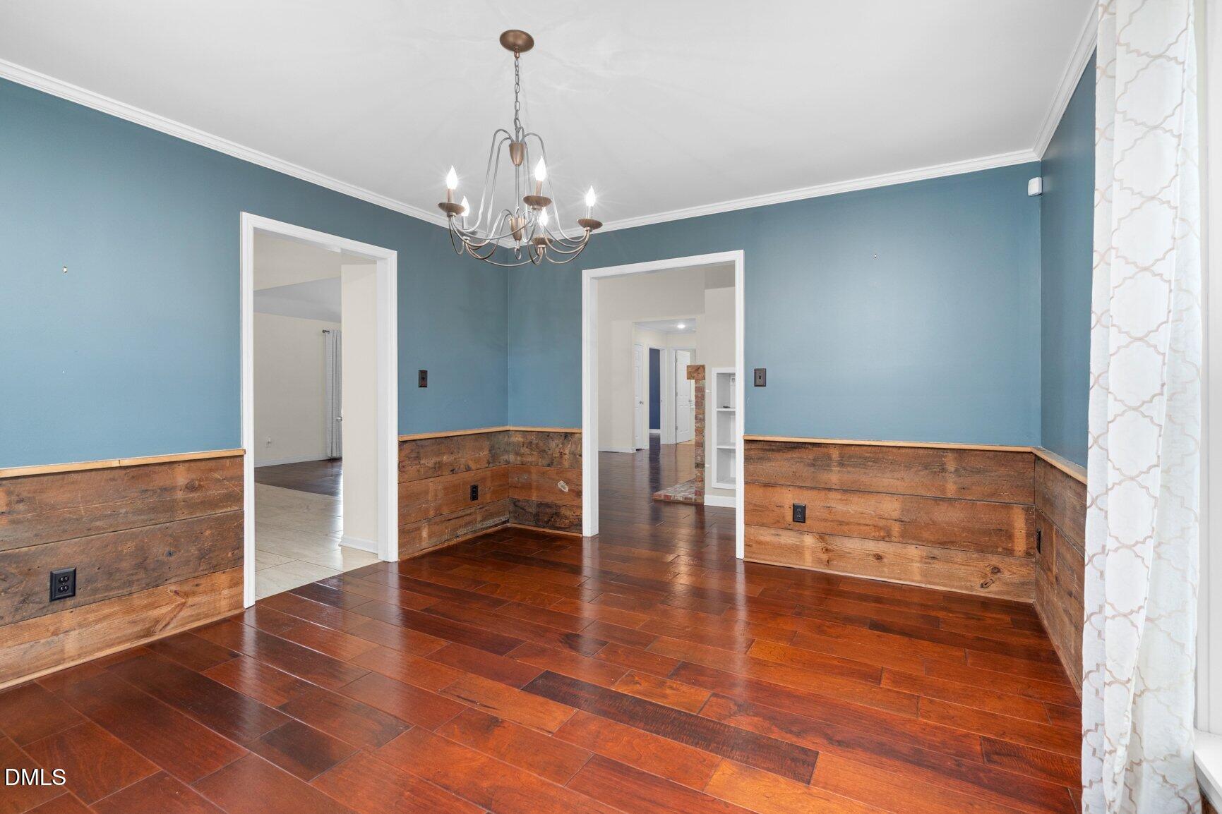 2141 McNair Road Tarboro, NC 27886 - Photo 9 of 55 a view of a room with wooden floor and staircase