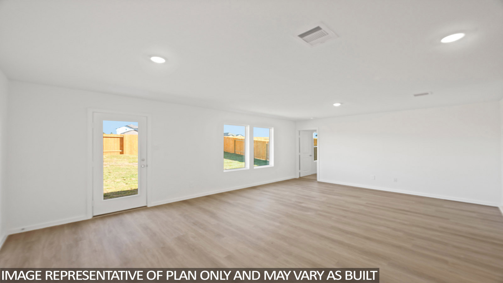 180 Baby Calf Roping Road Jarrell, TX 76537 - Photo 7 of 27 an empty room with wooden floor and window