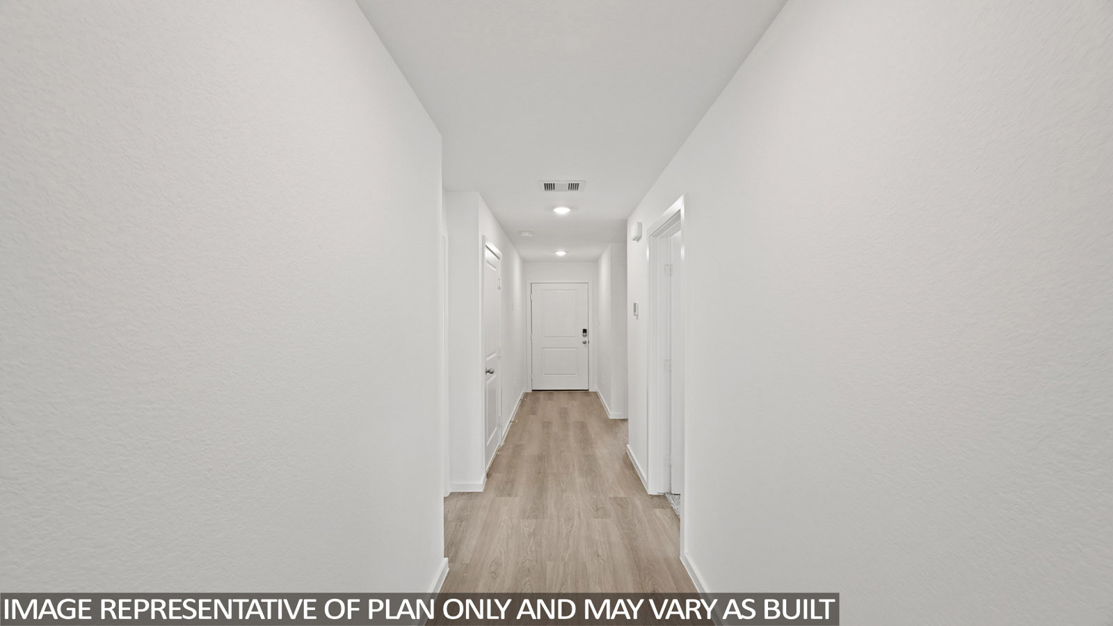 180 Baby Calf Roping Road Jarrell, TX 76537 - Photo 2 of 27 a view of a hallway with wooden floor and a bathroom