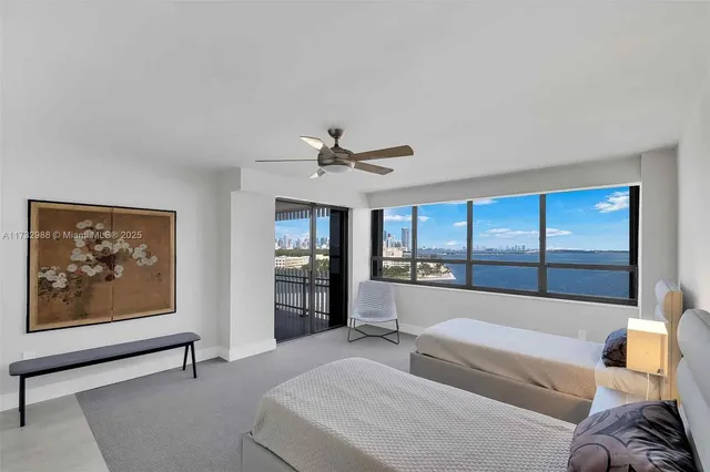 a spacious bedroom with a large bed and a couch