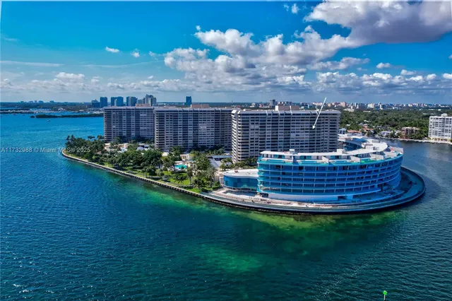 a view of a fountain in middle of the green field