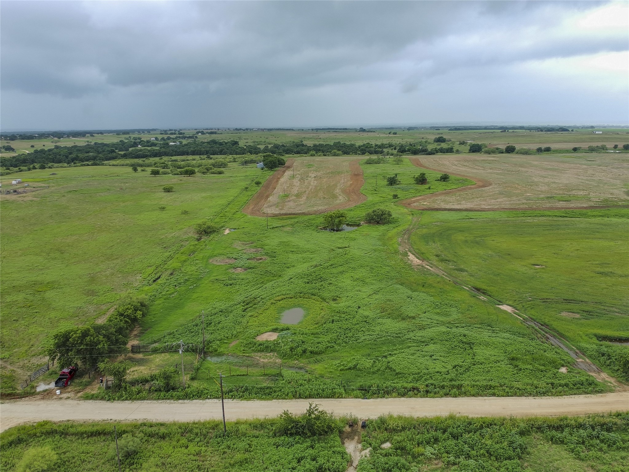 0 Cunningham Road Nocona, TX 76255 - Photo 7 of 11 a view of a lake with a big yard