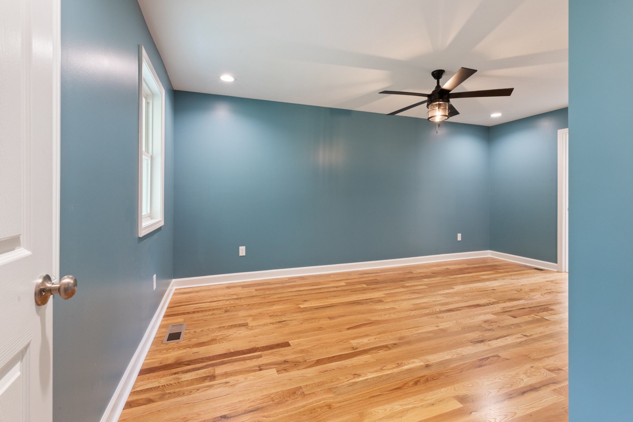 260 Old Highway 48 Charlotte, TN 37036 - Photo 14 of 71 a view of a big room with wooden floor closet and ceiling fan